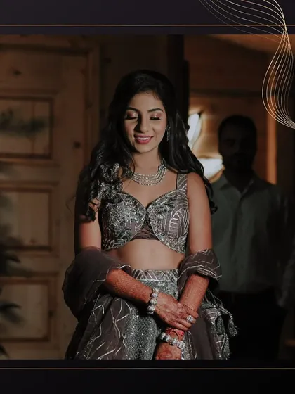 A quiet moment before the sangeet festivities begin. The bride looks serene and beautiful, her soft glam makeup enhancing her natural features.
