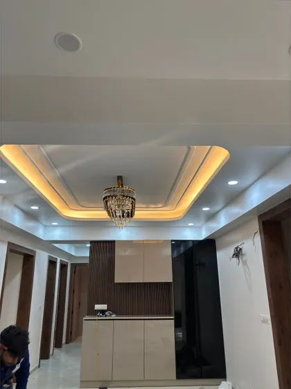 A look at our recently completed project, showcasing a beautiful bar and crockery unit with a statement chandelier. We are proud to deliver high-quality interiors.