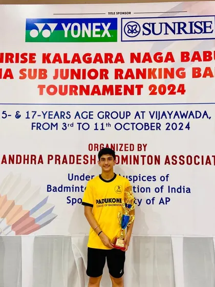 Medhansh Sharma stands proud with his trophy after becoming the U15 Boys Singles runner-up at the All India Ranking Badminton Tournament in Vijayawada.