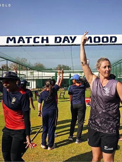 The 'Match Day Mood' is electric. The RCB women's team celebrates in front of our nets before a big game.