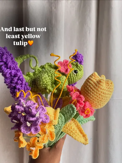 The final flower, a yellow tulip, is added to the Rapunzel bouquet before wrapping.
