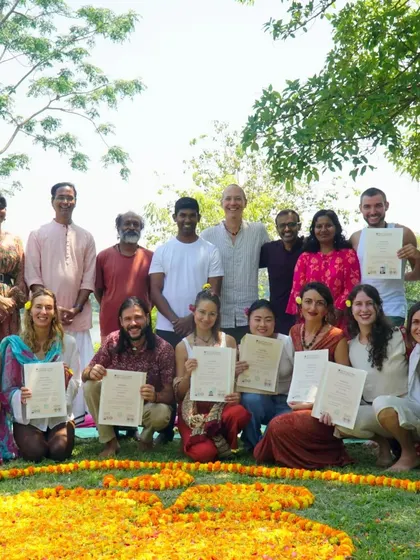 A joyful group of newly certified 300-hour yoga teachers and their instructors. This photo captures the sense of accomplishment and community that defines our graduation day.