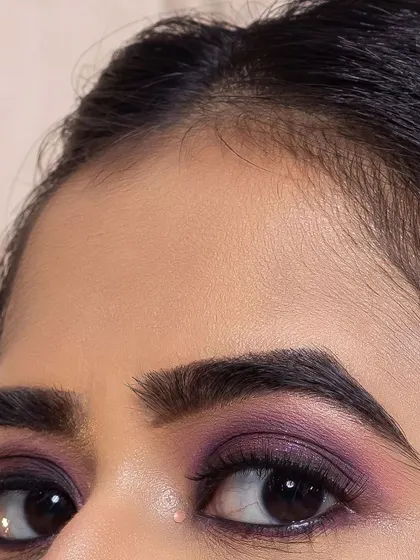 A detailed close-up of the purple smokey eye, showing the seamless gradient of color. Precision is a key skill I emphasize in my advanced workshops.