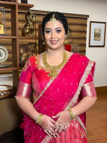 Lavanya looking radiant for her engagement. I designed this bright pink lehenga and blouse set with intricate gold embroidery around the neckline and sleeves for a celebratory look.