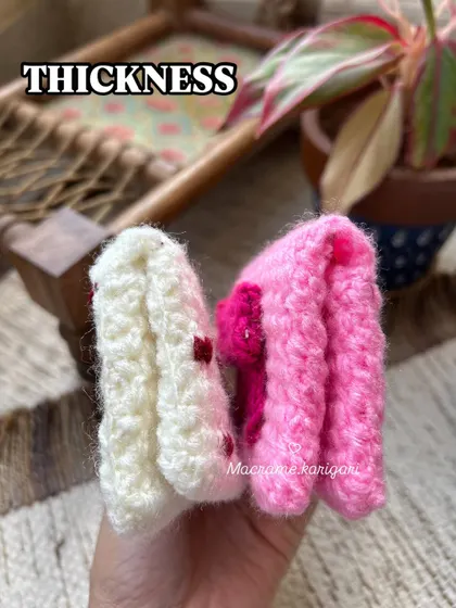 This photo shows the thickness of our crochet wallets, demonstrating how they are sturdy and well-padded to protect your cards.