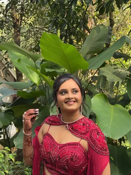 A happy, smiling shot of Shivani in her welcome attire, looking fresh and ready to greet her guests.