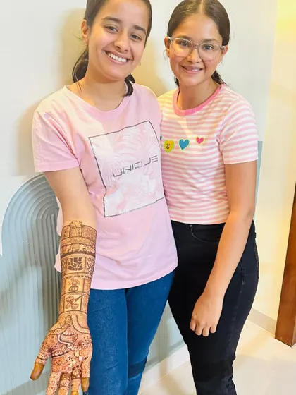 The smiles say it all. Another successful student from my April batch, showcasing the intricate bridal mehendi she mastered during our course.