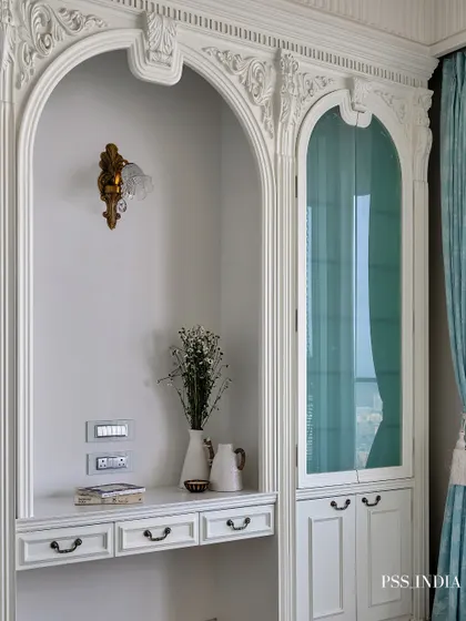 Softness in every corner, sophistication in every detail. This dreamy bedroom blends classic design, with its intricately carved moldings and pastel blue accents, with the calming energy of a modern sanctuary.