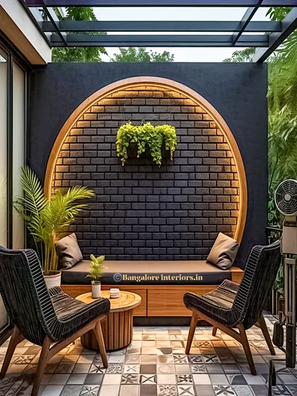 For a modern and sophisticated evening retreat, I focus on architectural elements and lighting. This design features a striking circular brick accent wall with integrated backlighting, creating a warm glow. The built-in seating and minimalist chairs make it a chic and intimate space for conversation.