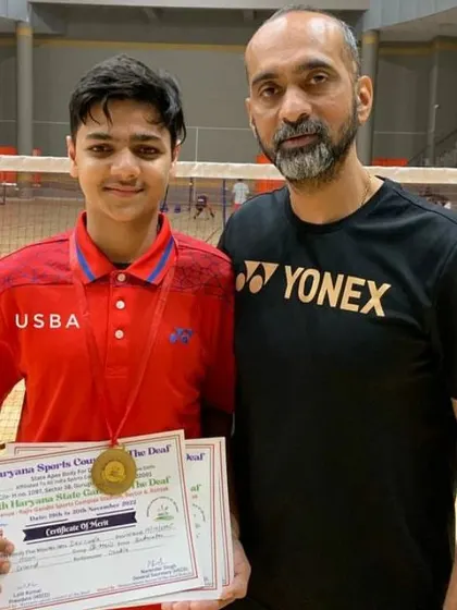 A close-up of my student with his medal and certificate from the Haryana State Games.