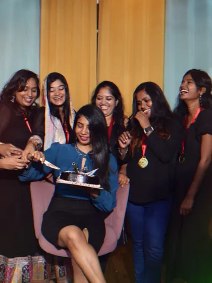 Sharing a laugh and some cake with my newly graduated students.