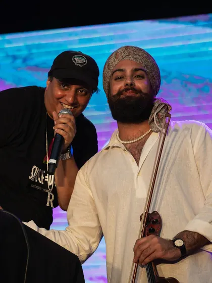 Rep the legacy! Our Basement Bhangra merch is available online. Here I am with a friend, both of us rocking the gear.