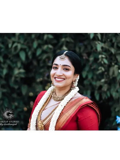 A happy, natural shot of Chinvatha on her wedding day. My philosophy is to enhance natural beauty, creating a look that is timeless and elegant.