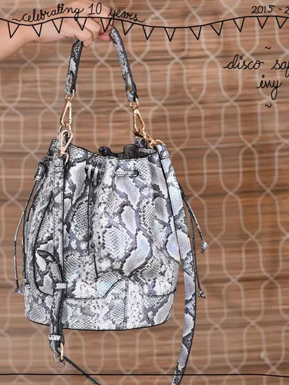 The Ivy bucket bag in our new Disco Safari leather. This print features a mix of grey and silver tones with a metallic foil finish, creating a versatile piece that works for both day and night.
