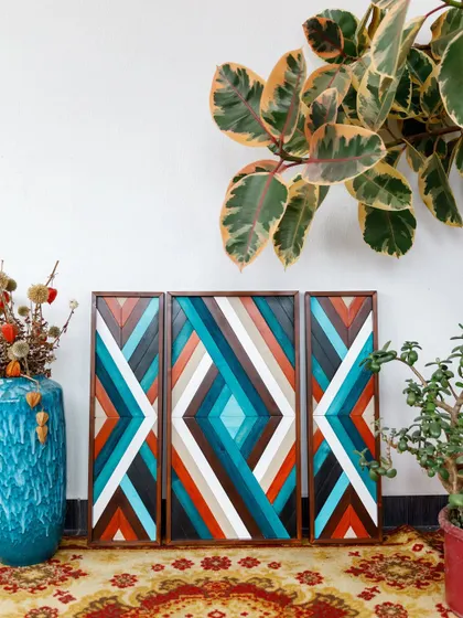 This image shows the three-panel boho set displayed on the floor, giving a clear view of the full design and its rich, earthy color palette.