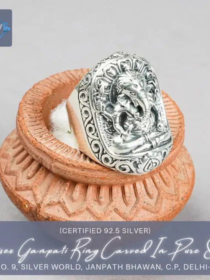 A bold, unisex Ganpati ring carved from pure 92.5 silver. The large, rectangular face features a detailed depiction of Lord Ganesha, framed by an ornate border.