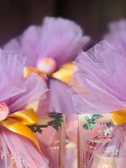 A close-up of the lavender net wrapping on the corporate hampers, showing the delicate floral detail at the top.