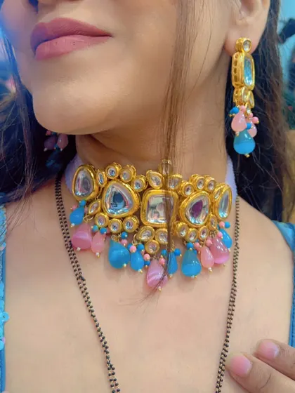A close-up of a different jewellery option: a modern Kundan choker with pink and blue beads.