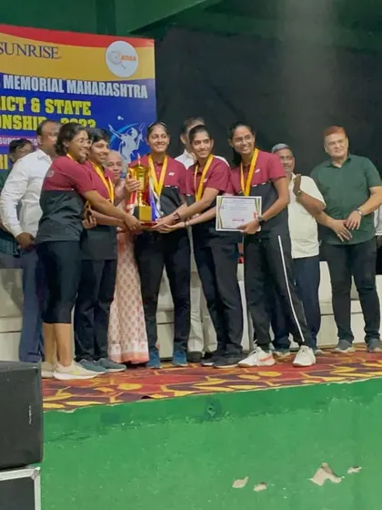 The team on stage receiving their award. These experiences build character and a winning mindset.