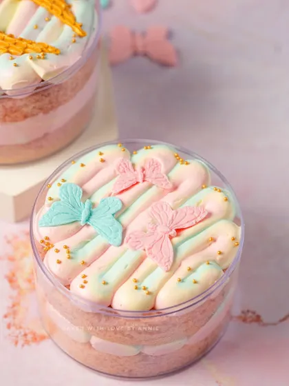 Another look at my whimsical cake tubs, this one adorned with pastel-colored buttercream piping and delicate edible butterflies. Perfect for a dreamy celebration.