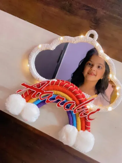 Another lovely photo of a client enjoying her personalized cloud mirror. It's so rewarding to see my creations bring smiles to their new owners.