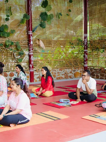 Students listen intently during a theory session. Understanding the science and philosophy behind sound healing is as important as the practical application.