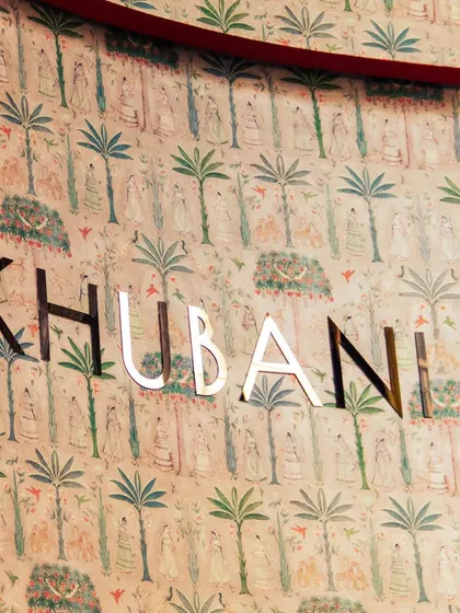 The walls of Khubani. Our custom wallpaper, featuring Persian-inspired art, is a key element of our immersive and sophisticated interior design.