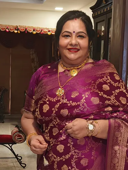 I love working with this adorable client. For this event, we chose a classic red lip and a traditional updo with a gajra, a look that is always elegant.