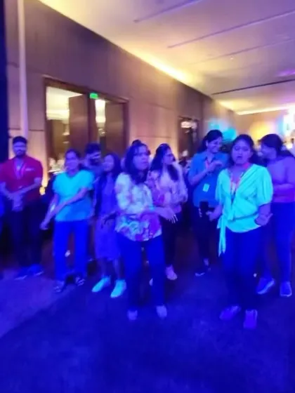 A group of colleagues dancing and enjoying the music together. This is what corporate parties are for.