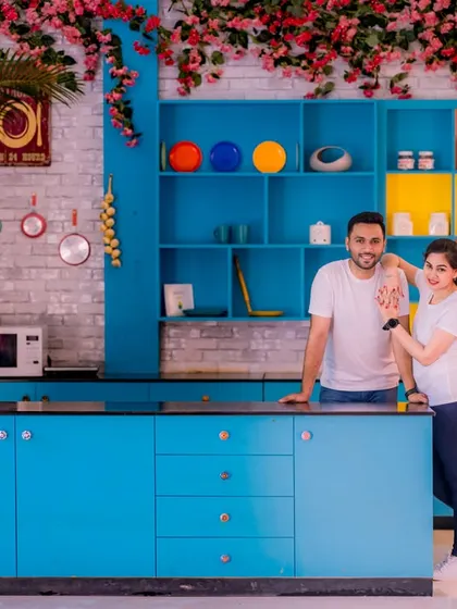A fun and quirky shot in a colorful, retro-style kitchen. This setup is perfect for couples who want to show off their playful side.