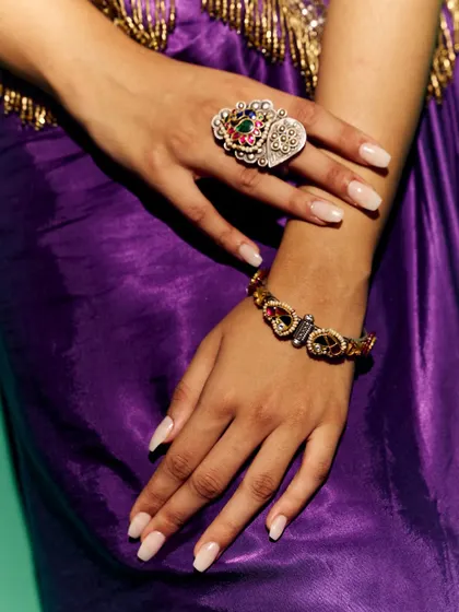 A detail shot focusing on the accessories for the Myntra shoot. I paired the purple outfit with a statement ring and bracelet to complement the intricate embroidery of the vest.