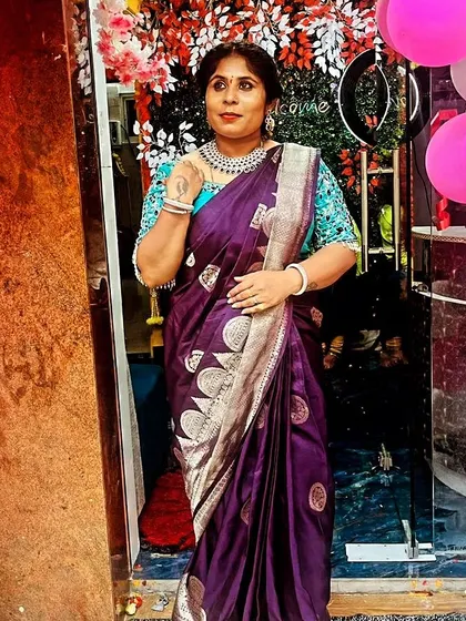 A full-length view of the client ready for her event in a beautiful rental saree.