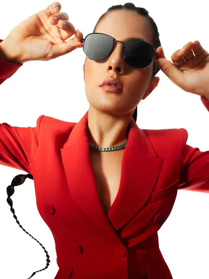 A confident close-up in a vibrant red suit. This is a powerful commercial-editorial look for a model's portfolio.