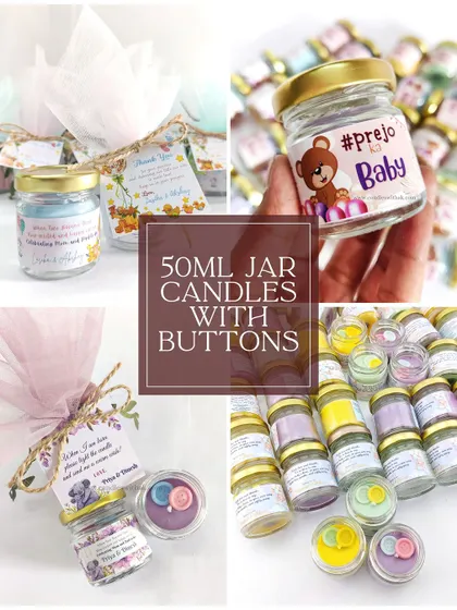 These 50ml jar candles with cute button toppers are a budget-friendly and charming option for baby shower return gifts, available in a range of pastel colors.