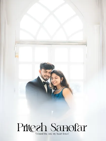 An ethereal, high-key portrait of a couple against a large arched window, creating a soft and dreamy effect.