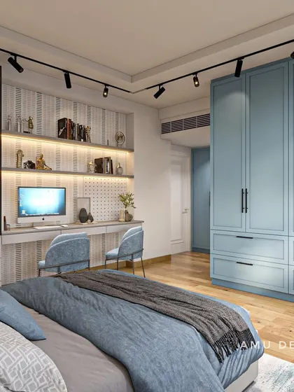 A modern and functional bedroom design, featuring a built-in study table with extensive shelving and a large wardrobe in a calming powder blue finish.