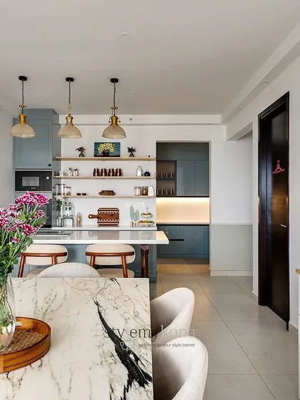 The dining and kitchen area viewed from the living room, showcasing the open and connected layout.