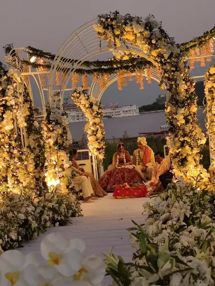 The intricate floral decor and lighting of a mandap at a luxury destination wedding. We ensure our on-stage entertainment complements the aesthetic of your event perfectly.