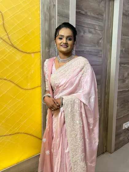 A happy, smiling bride ready for her reception party. The look is designed to be comfortable and long-lasting.