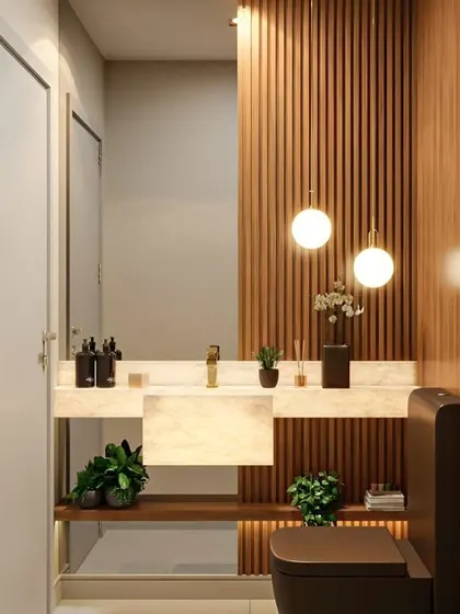 I used vertical wooden slats as an accent wall in this bathroom, adding texture and warmth. The pendant lights and marble countertop elevate the space, giving it a touch of modern luxury.