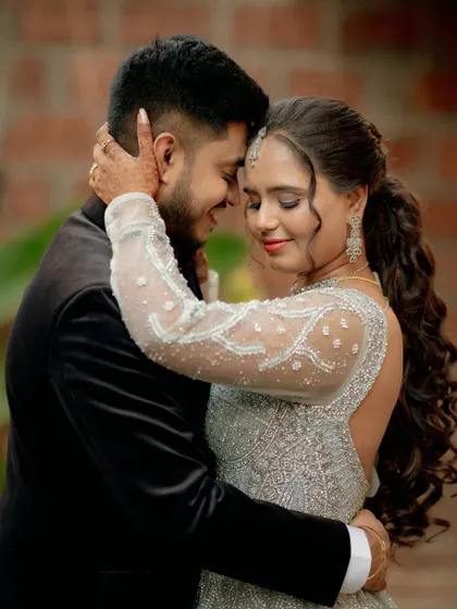 A tender and intimate portrait of Lavanya and Akshay, capturing their close bond on their reception night.