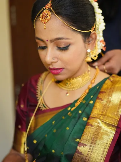 A close up of this stunning Tamil Iyer bride. I focused on creating sharp, defined eyes with a classic winged liner and a bold lip, a look that is both traditional and striking.