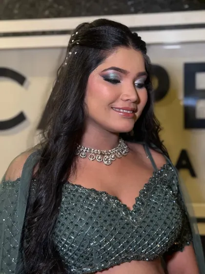 The smile says it all. This look balances a bold, metallic eye with a soft, natural base and lip color.