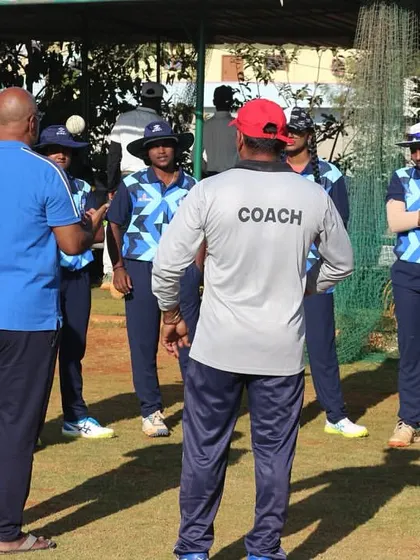 The coach's perspective during a team huddle, where instructions are given and team spirit is reinforced.