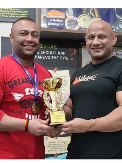 With my Guruji, Mukesh Gahlot, after winning the Strong Man title at the Senior Delhi State competition. Learning from the best to be the best.