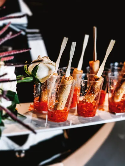 I believe in innovative presentation. Here, savory rolls are served in individual glasses with a dipping sauce, a mess-free and stylish way for guests to enjoy appetizers.