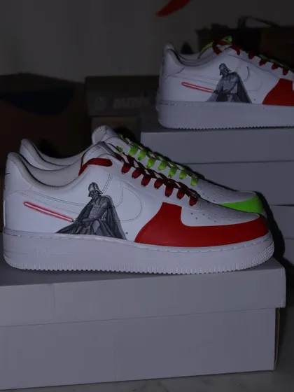 A pair of the Darth Vader custom sneakers. I used a bold red and white color-blocking design to represent the dark side, with Vader and his red lightsaber as the centerpiece.