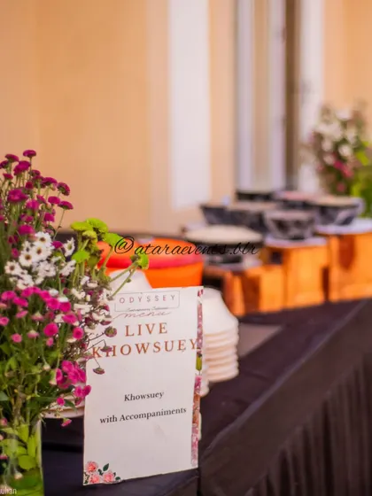 A live food station at a jungle-themed party. The menu for "Live Khowsuey" is displayed, showing that I also coordinate catering and food experiences that match the event's theme.