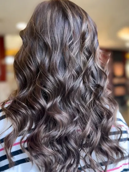 What do you think of this hair color? A beautiful example of a soft, wavy balayage with perfectly blended tones.