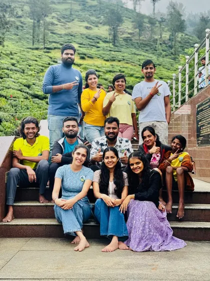 A happy group posing on some steps, smiles all around.